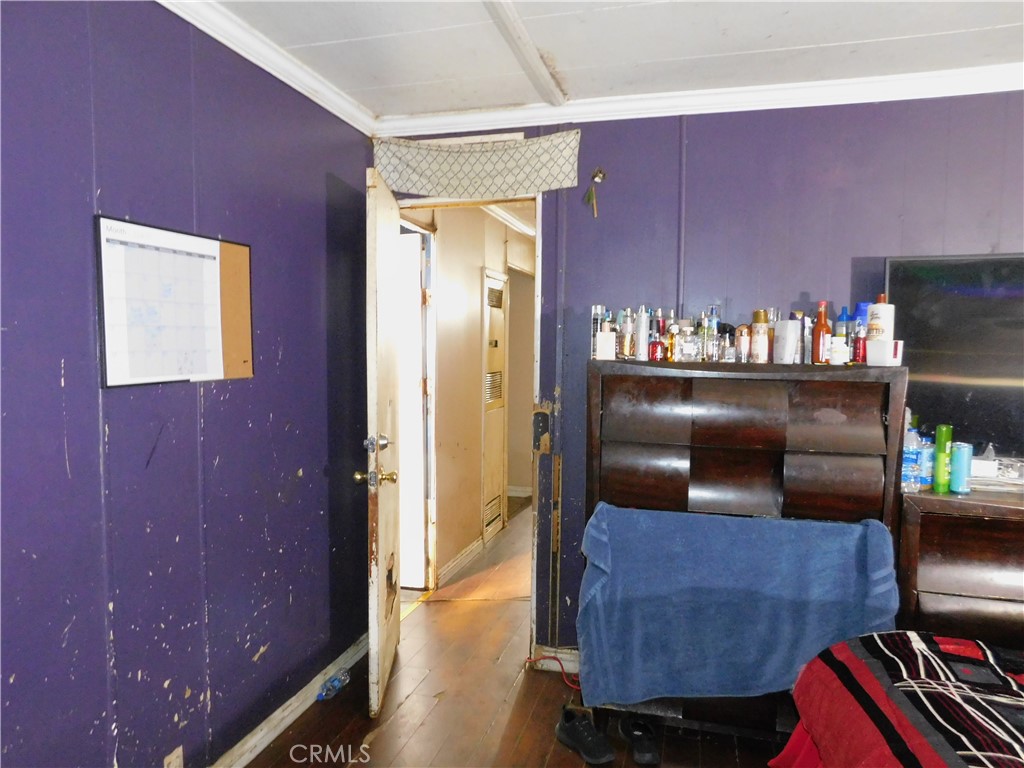 1097 North State Street, Unit 557 Hemet, CA 92543 - Photo 17 of 18 a hallway with furniture and lamp