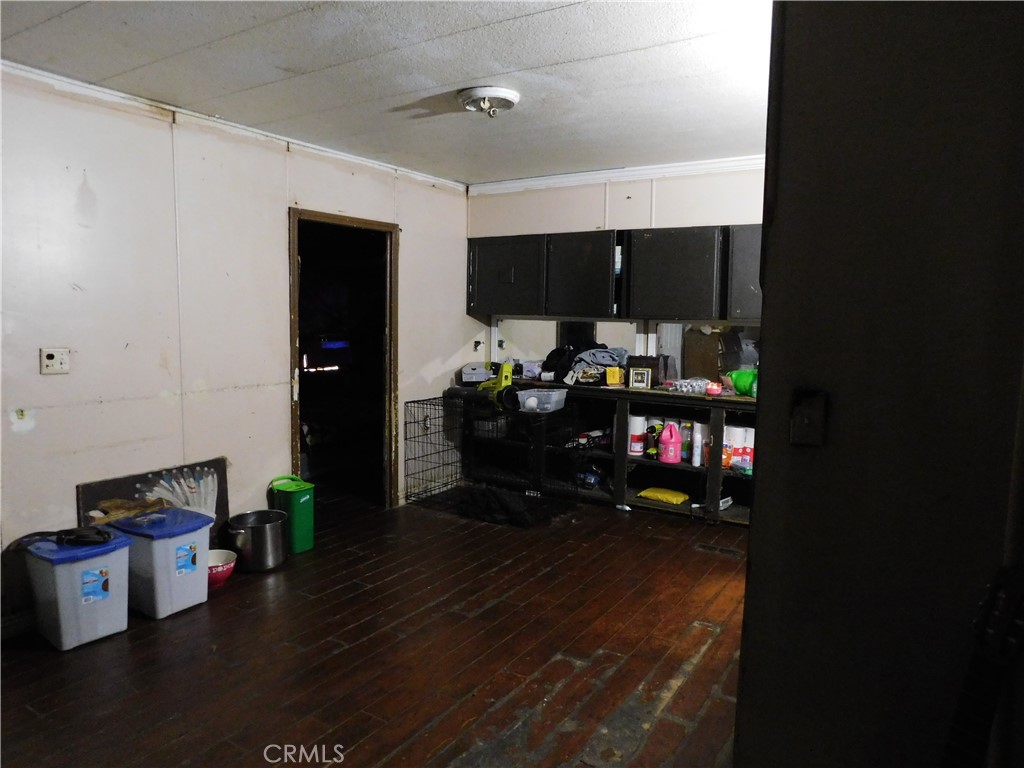 1097 North State Street, Unit 557 Hemet, CA 92543 - Photo 5 of 18 a living room with furniture and a flat screen tv