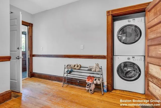 a view of a storage & utility room with a washer dryer