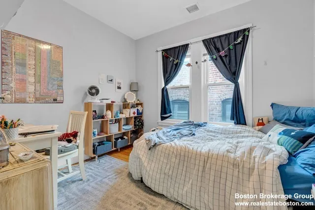 a bed room with a bed and a baby crib