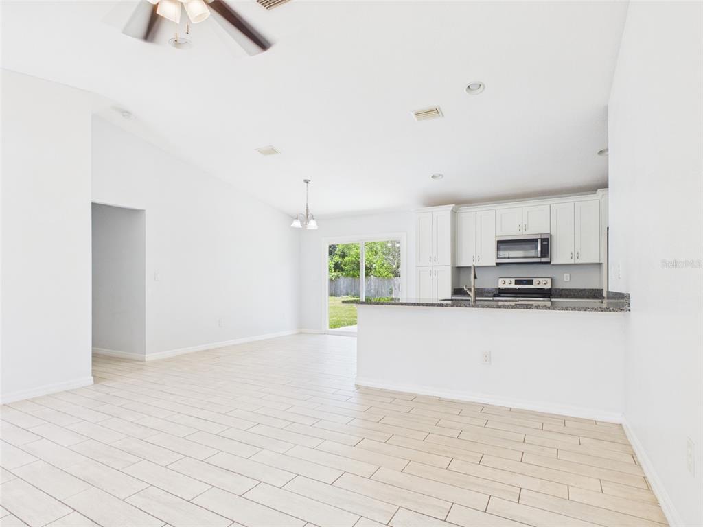 4309 Southwest 143rd Ln Road Ocala, FL 34473 - Photo 6 of 21 a view of kitchen with sink microwave and stove top oven