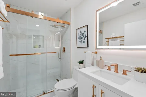 a utility room with sink dryer and washer