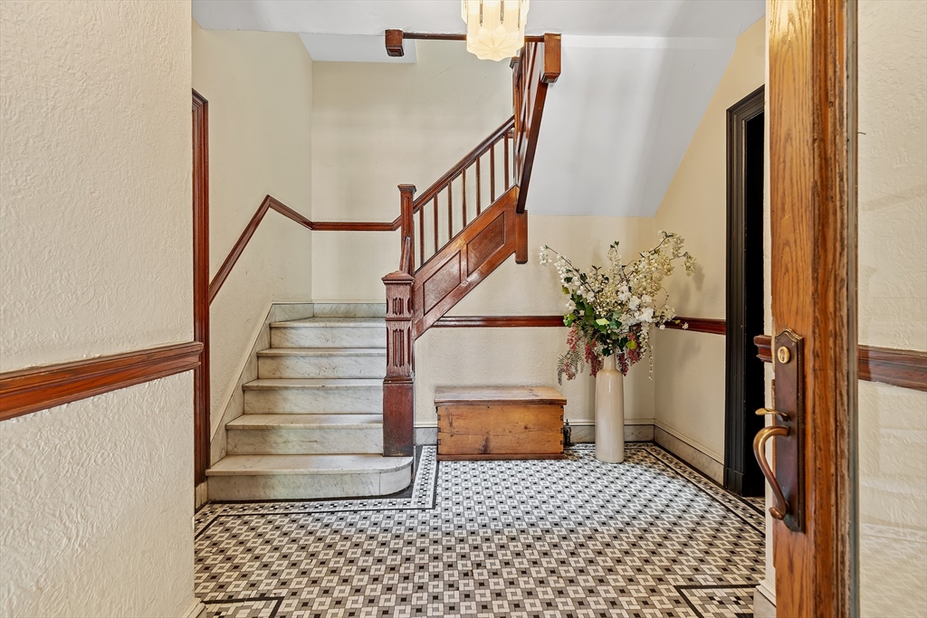 127 Winthrop Road, Unit 6A Brookline, MA 02445 - Photo 4 of 10 a view of entryway with wooden floor and stairs