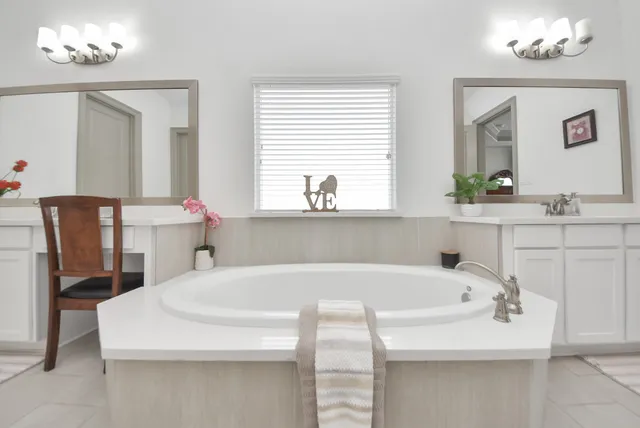 a bathroom with a bathtub and a sink