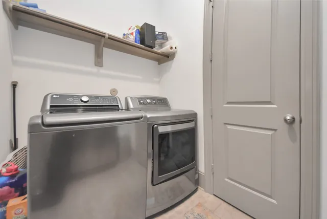 a stove top oven sitting inside of a kitchen