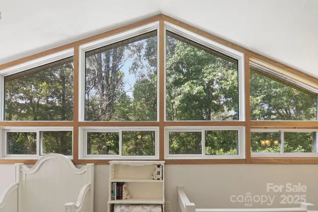 a view of a room that has a large window