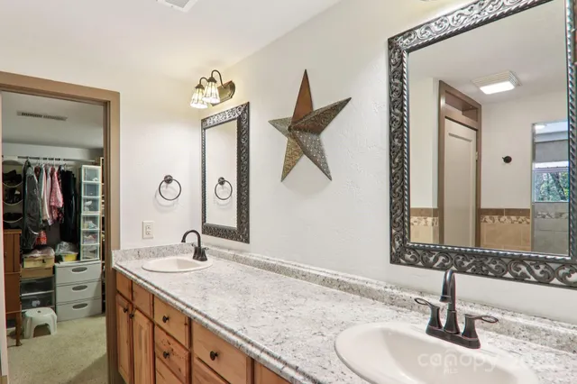 a kitchen with a refrigerator and a stove top oven