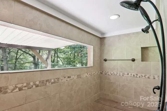 a large kitchen with a table and chairs