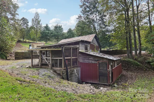 a view of a patio with table and chairs and potted plants