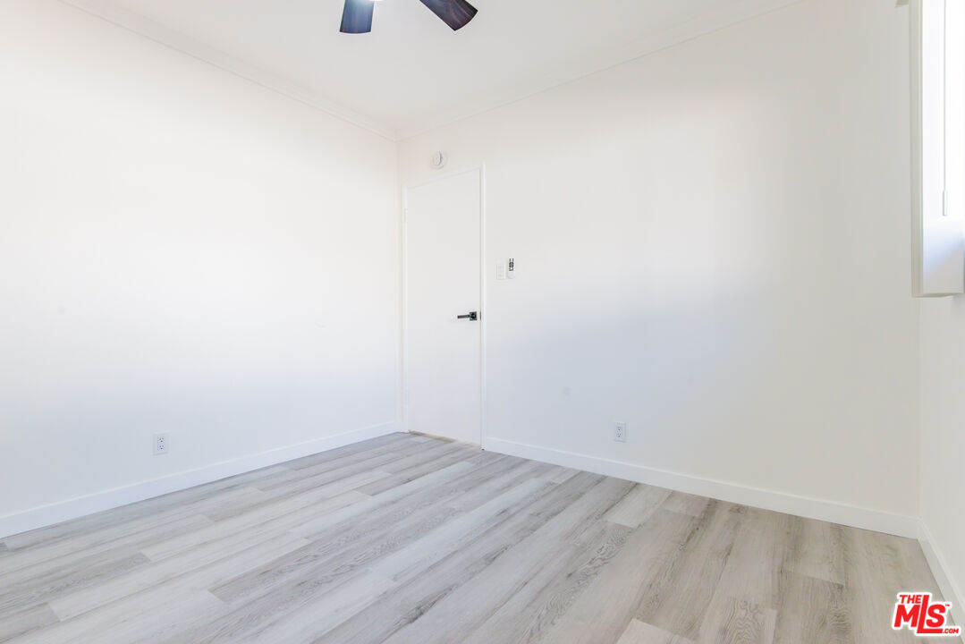 2107 Pullman Lane, Unit D Redondo Beach, CA 90278 - Photo 14 of 32 a view of a room with wooden floor