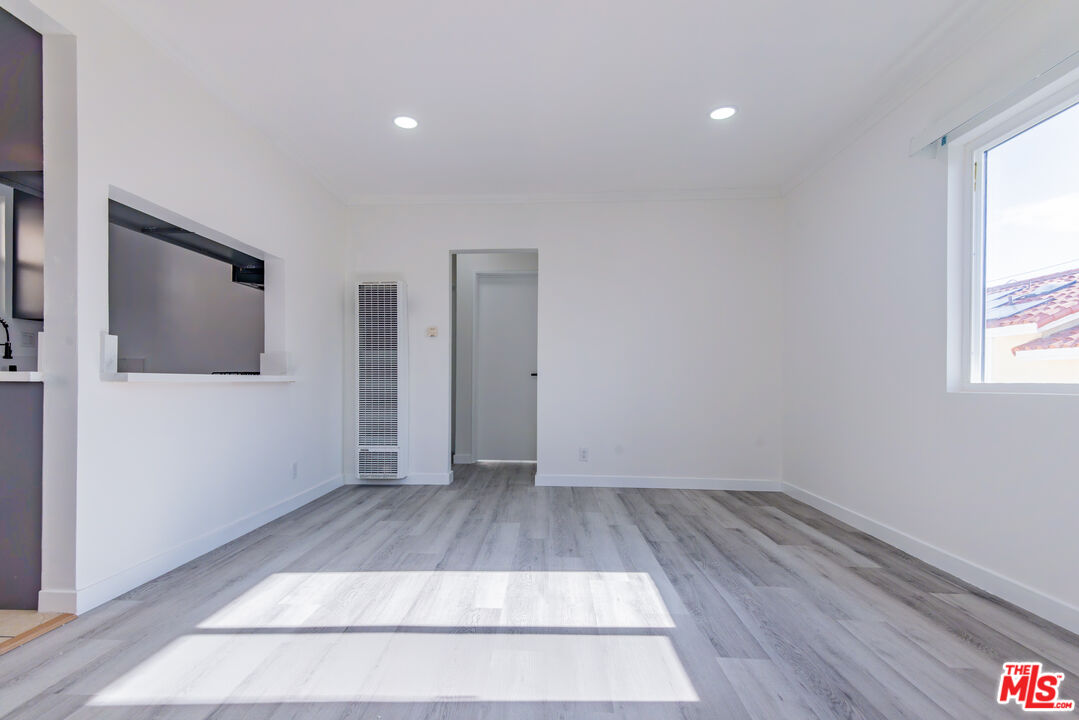 2107 Pullman Lane, Unit D Redondo Beach, CA 90278 - Photo 2 of 32 a view of room with window and hardwood floor