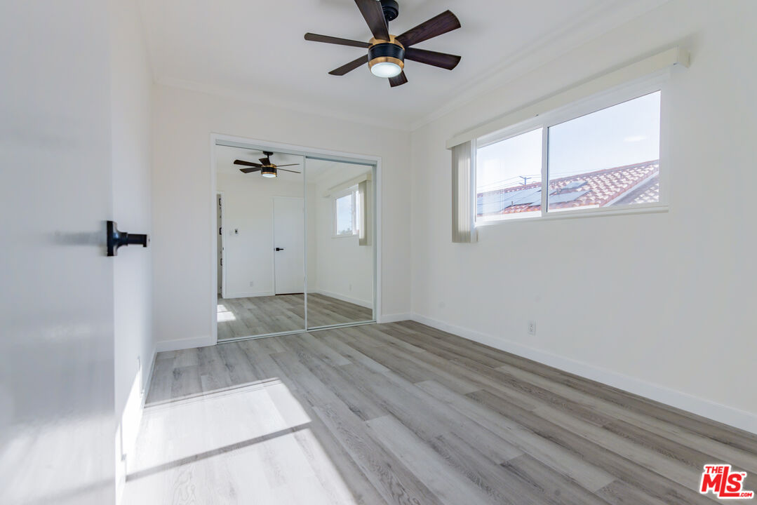 2107 Pullman Lane, Unit D Redondo Beach, CA 90278 - Photo 24 of 32 a view of an empty room with a window