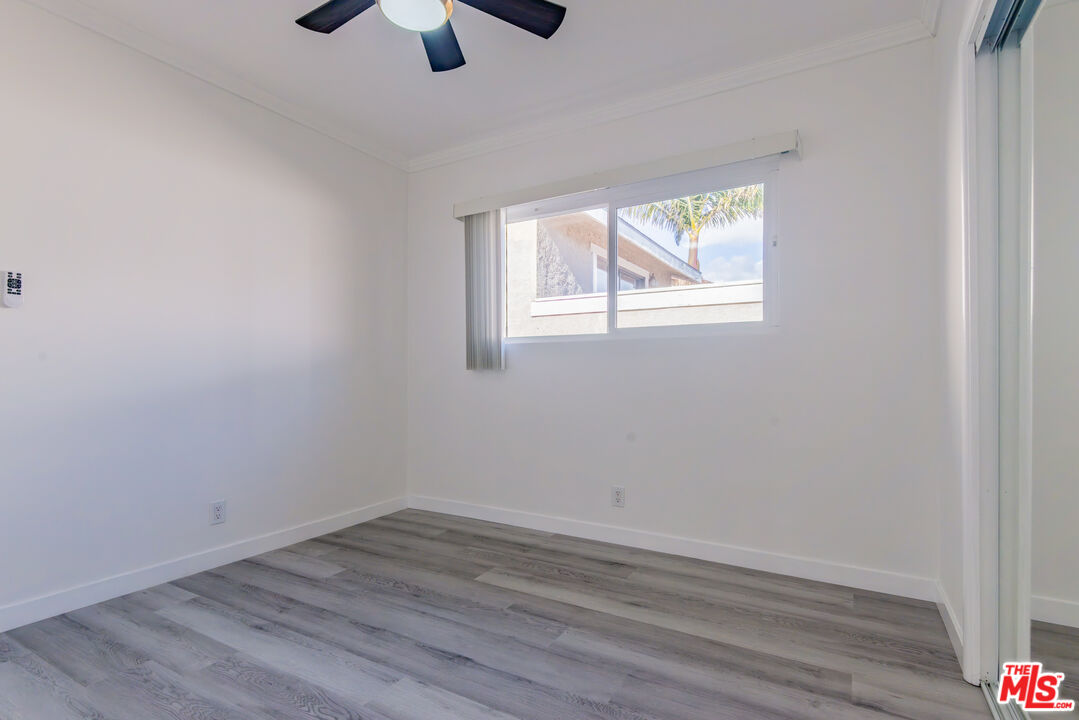 2107 Pullman Lane, Unit D Redondo Beach, CA 90278 - Photo 25 of 32 wooden floor in an empty room with a window