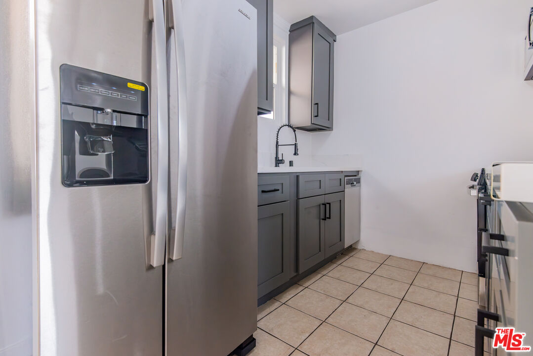 2107 Pullman Lane, Unit D Redondo Beach, CA 90278 - Photo 9 of 32 a view of a bathroom with a sink and mirror