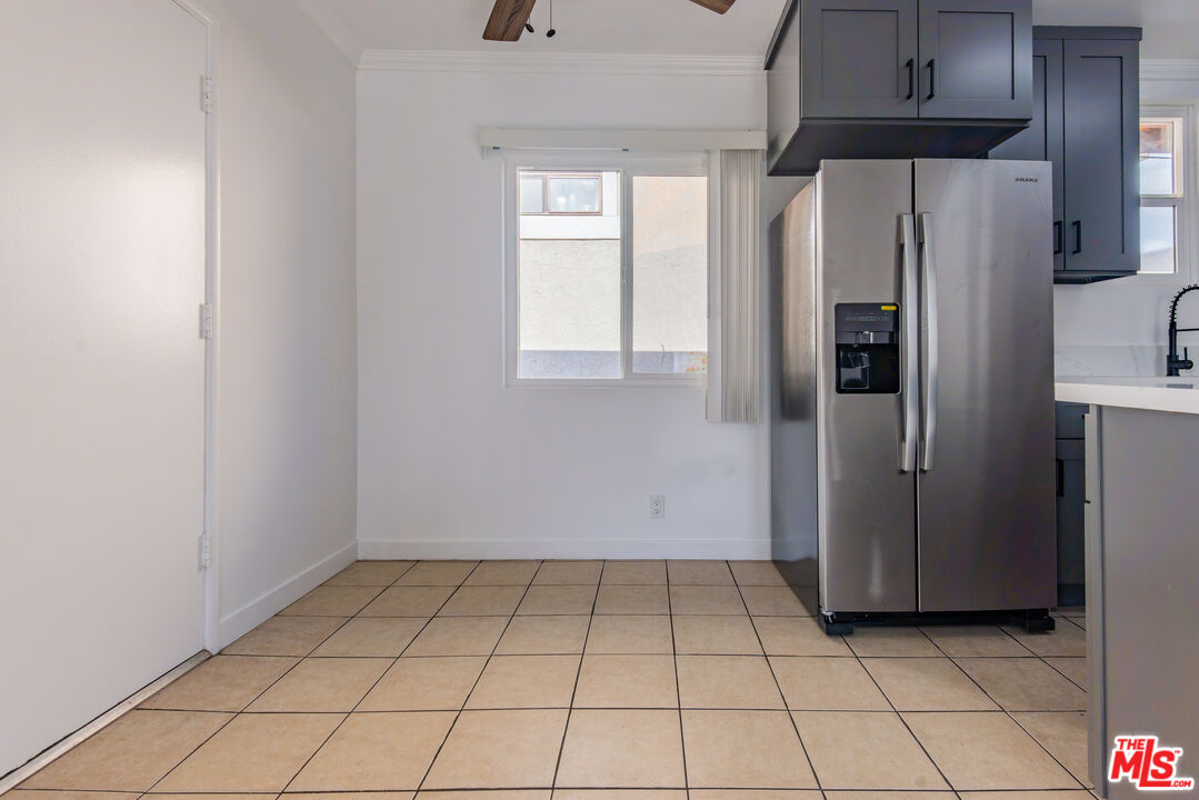 2107 Pullman Lane, Unit D Redondo Beach, CA 90278 - Photo 10 of 32 a view of a kitchen with a refrigerator cabinets and a window