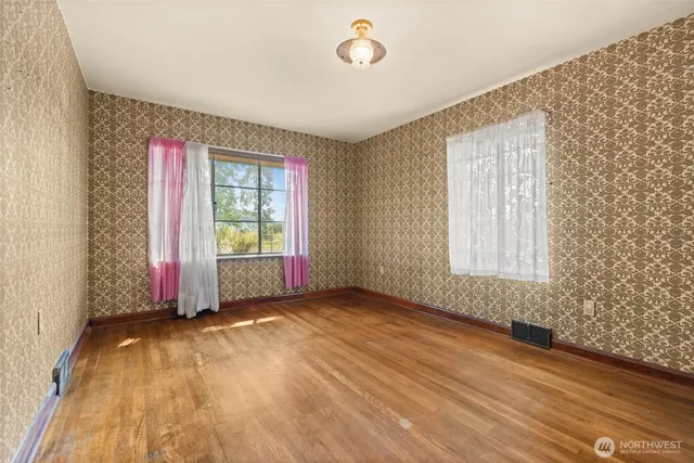a view of an empty room with a window