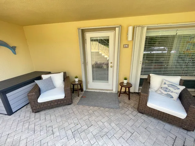 a view of balcony with furniture