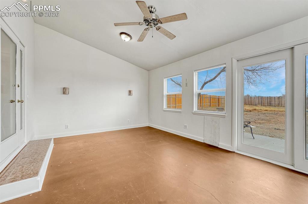 7815 Maverick Road Colorado Springs, CO 80908 - Photo 15 of 41 Finished and heated sunroom with walkout to backyard. So many possibilities for this space!