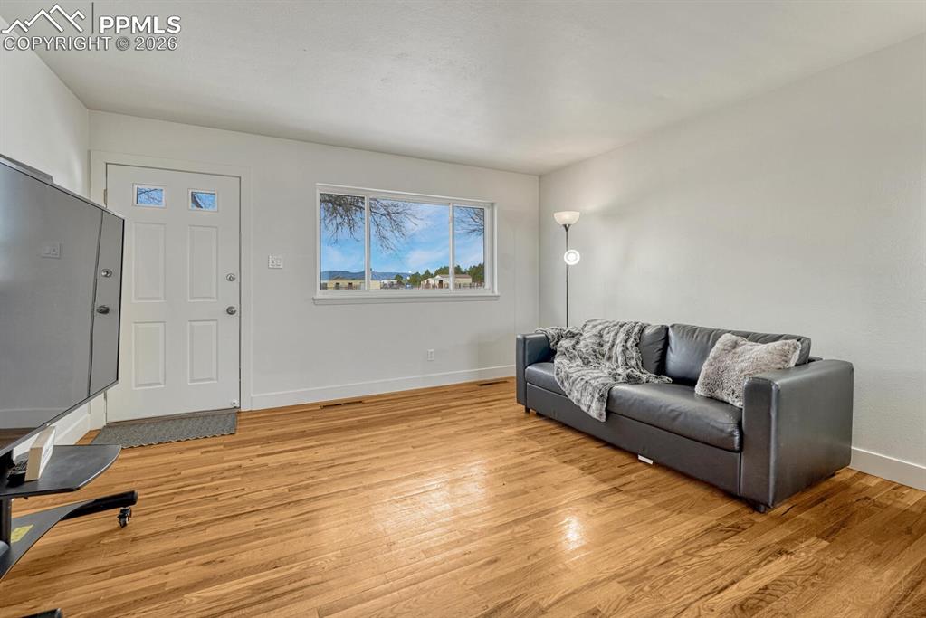 7815 Maverick Road Colorado Springs, CO 80908 - Photo 25 of 41 Second entrance and living room on south side of the home. Mountain views!