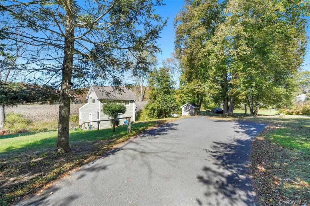 241 Smith Clove Road Highland Mills, NY 10930 - Photo 18 of 26 a view of a road with trees