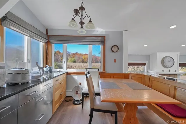 a large kitchen with a table and chairs