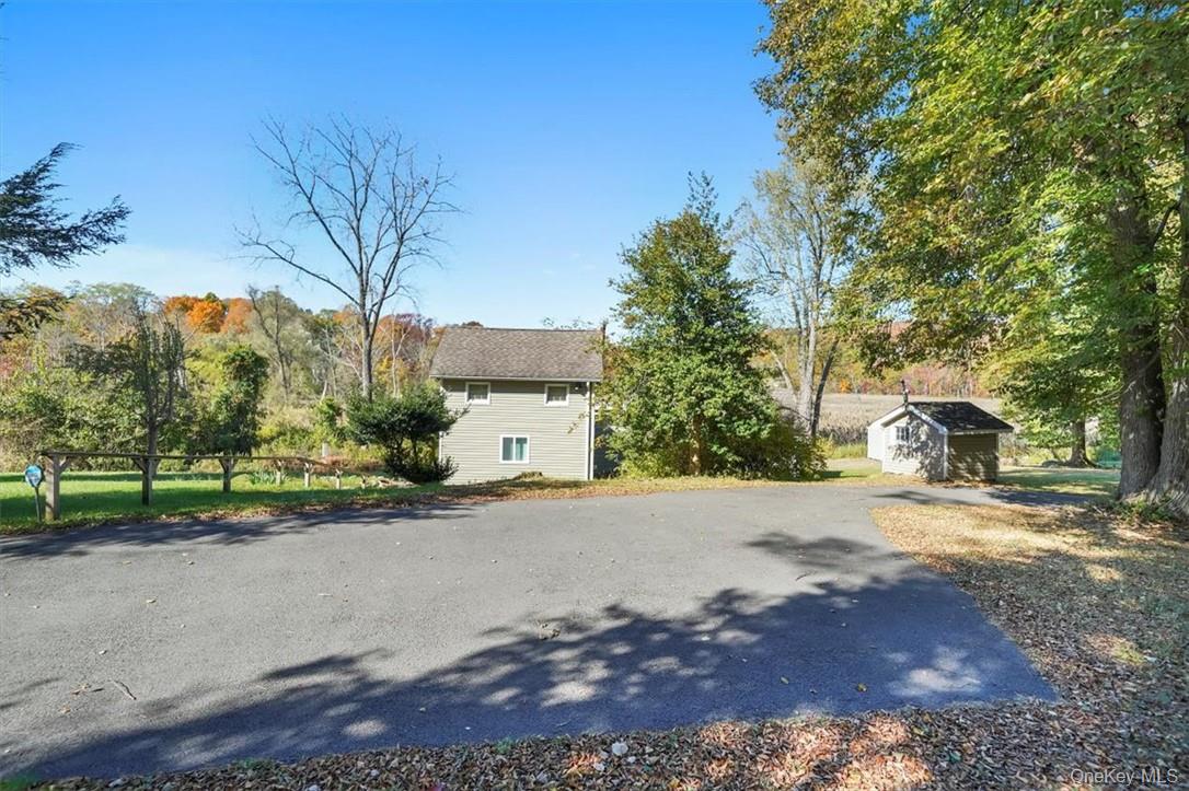241 Smith Clove Road Highland Mills, NY 10930 - Photo 22 of 26 a front view of a house with a yard and a garage
