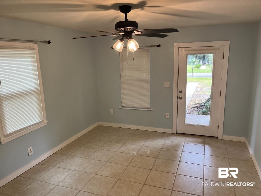 609 East Orange Avenue Foley, AL 36535 - Photo 3 of 6 Entryway with light tile patterned floors and ceiling fan