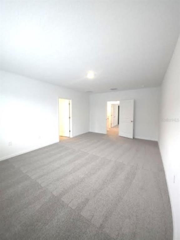 35589 Lockman Way Zephyrhills, FL 33541 - Photo 17 of 54 a view of empty room