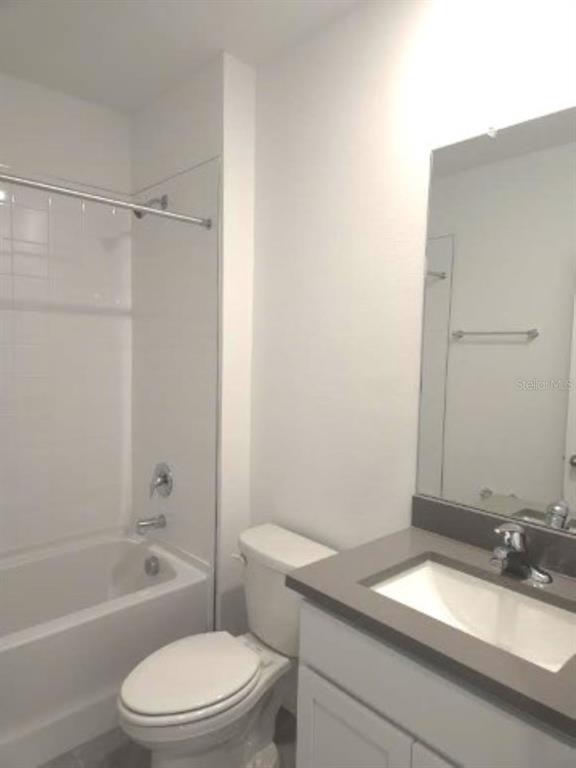 35589 Lockman Way Zephyrhills, FL 33541 - Photo 25 of 54 a bathroom with a granite countertop sink toilet and shower