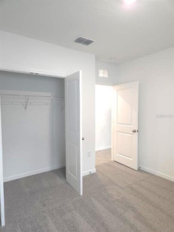 35589 Lockman Way Zephyrhills, FL 33541 - Photo 27 of 54 a view of an empty room