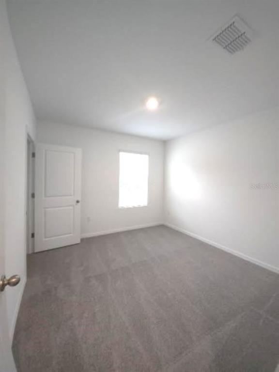 35589 Lockman Way Zephyrhills, FL 33541 - Photo 34 of 54 an empty room with windows