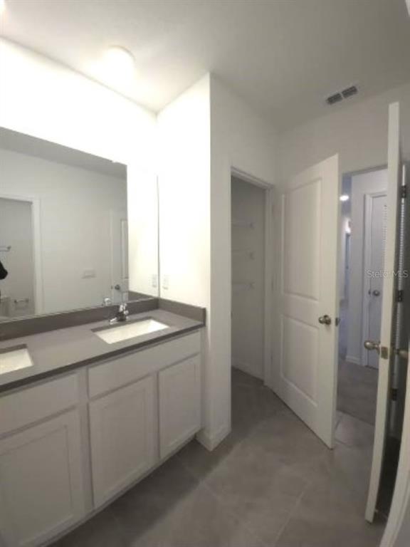 35589 Lockman Way Zephyrhills, FL 33541 - Photo 35 of 54 a bathroom with a granite countertop sink and a mirror