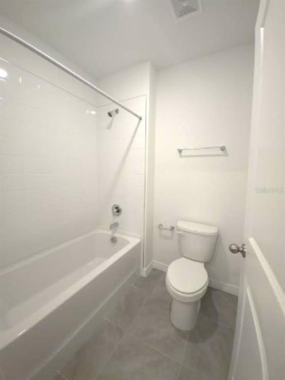35589 Lockman Way Zephyrhills, FL 33541 - Photo 39 of 54 a white toilet sitting next to a bath tub
