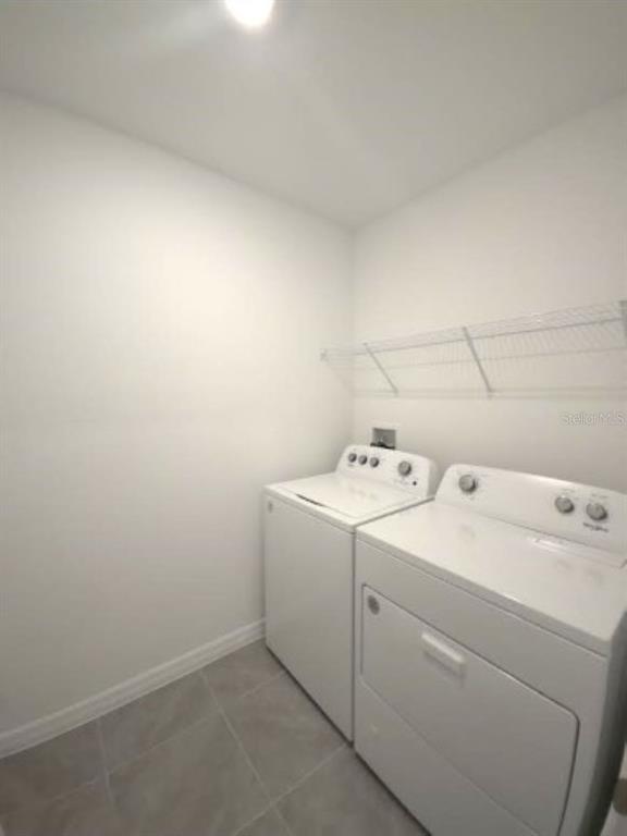 35589 Lockman Way Zephyrhills, FL 33541 - Photo 42 of 54 a utility room with dryer and washer
