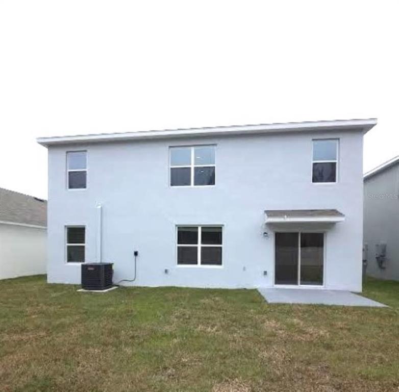 35589 Lockman Way Zephyrhills, FL 33541 - Photo 46 of 54 a house that has a window in it