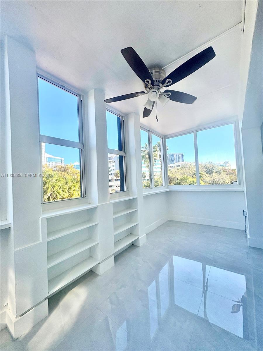 9159 Southwest 77th Avenue, Unit 314 Miami, FL 33156 - Photo 12 of 53 a view of room with window and ceiling fan