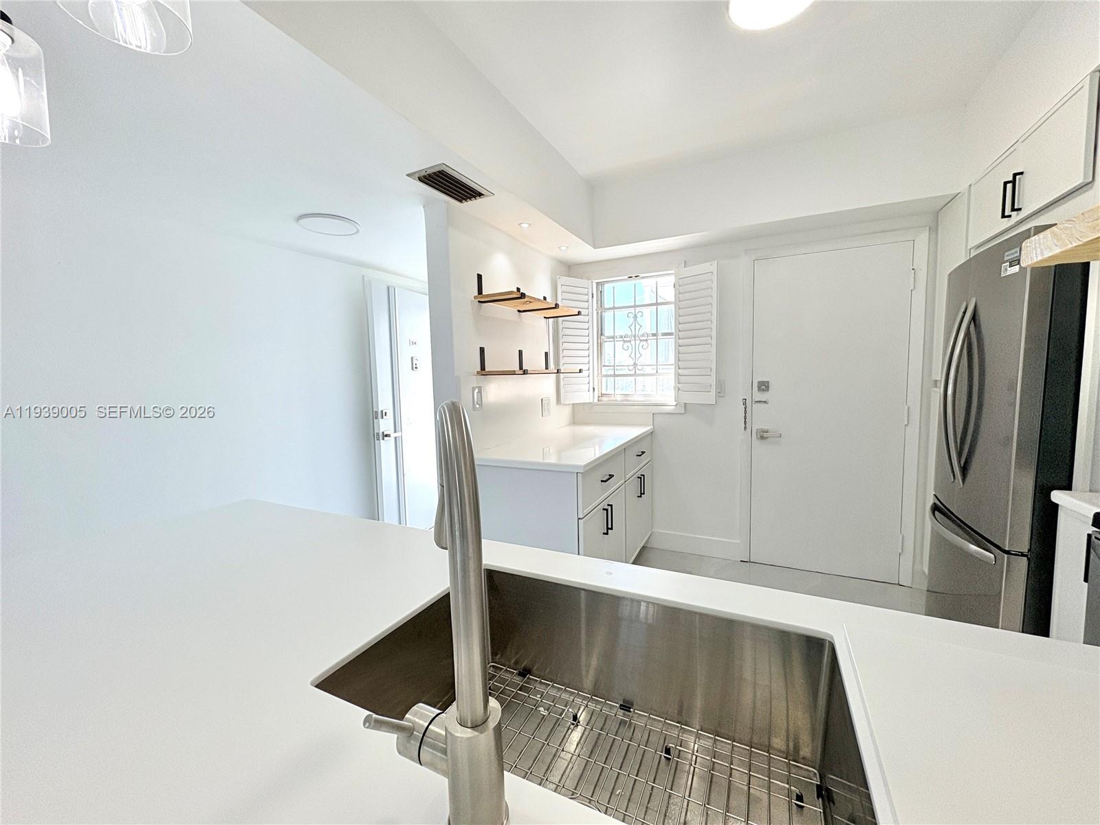 9159 Southwest 77th Avenue, Unit 314 Miami, FL 33156 - Photo 16 of 53 a view of kitchen with furniture and refrigerator
