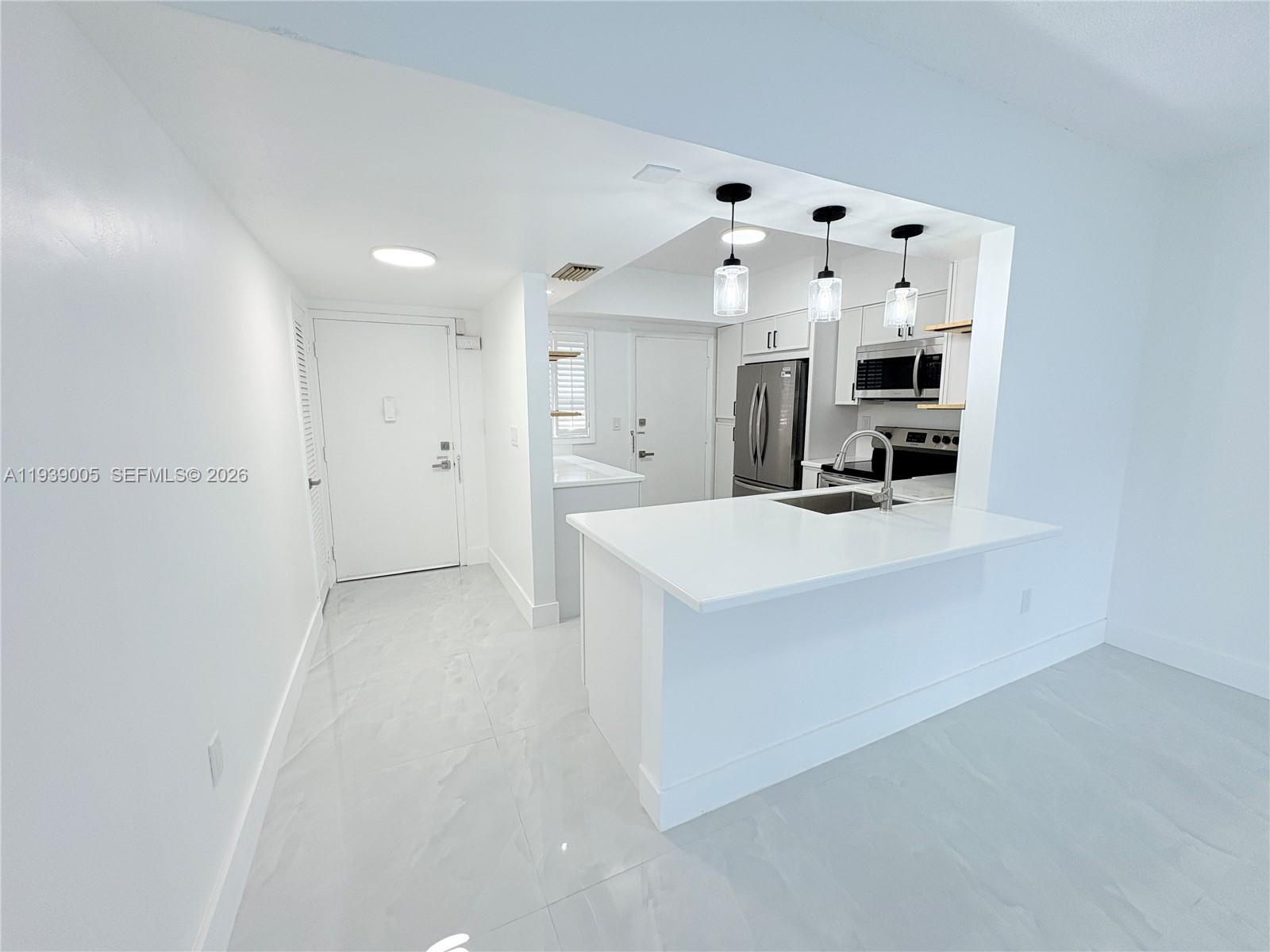 9159 Southwest 77th Avenue, Unit 314 Miami, FL 33156 - Photo 20 of 53 a view of living room with furniture and fireplace