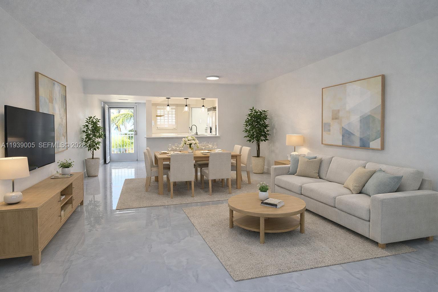 9159 Southwest 77th Avenue, Unit 314 Miami, FL 33156 - Photo 2 of 53 a living room with furniture and a flat screen tv