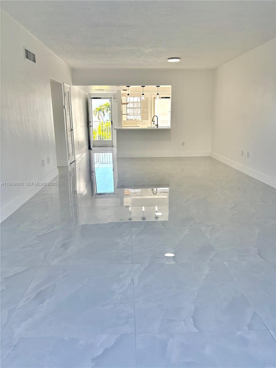 9159 Southwest 77th Avenue, Unit 314 Miami, FL 33156 - Photo 22 of 53 a view of an empty room with window