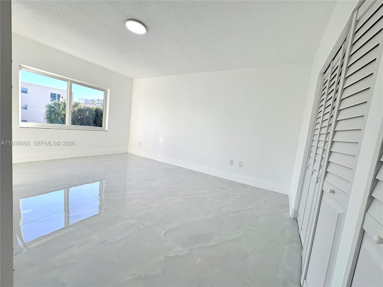 9159 Southwest 77th Avenue, Unit 314 Miami, FL 33156 - Photo 29 of 53 a view of hallway with window