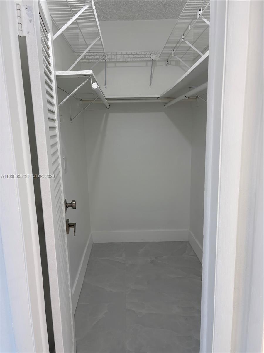 9159 Southwest 77th Avenue, Unit 314 Miami, FL 33156 - Photo 33 of 53 an empty walk in closet