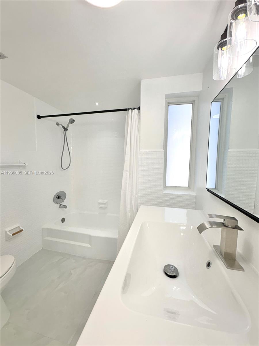 9159 Southwest 77th Avenue, Unit 314 Miami, FL 33156 - Photo 34 of 53 a bathroom with a bathtub and a shower