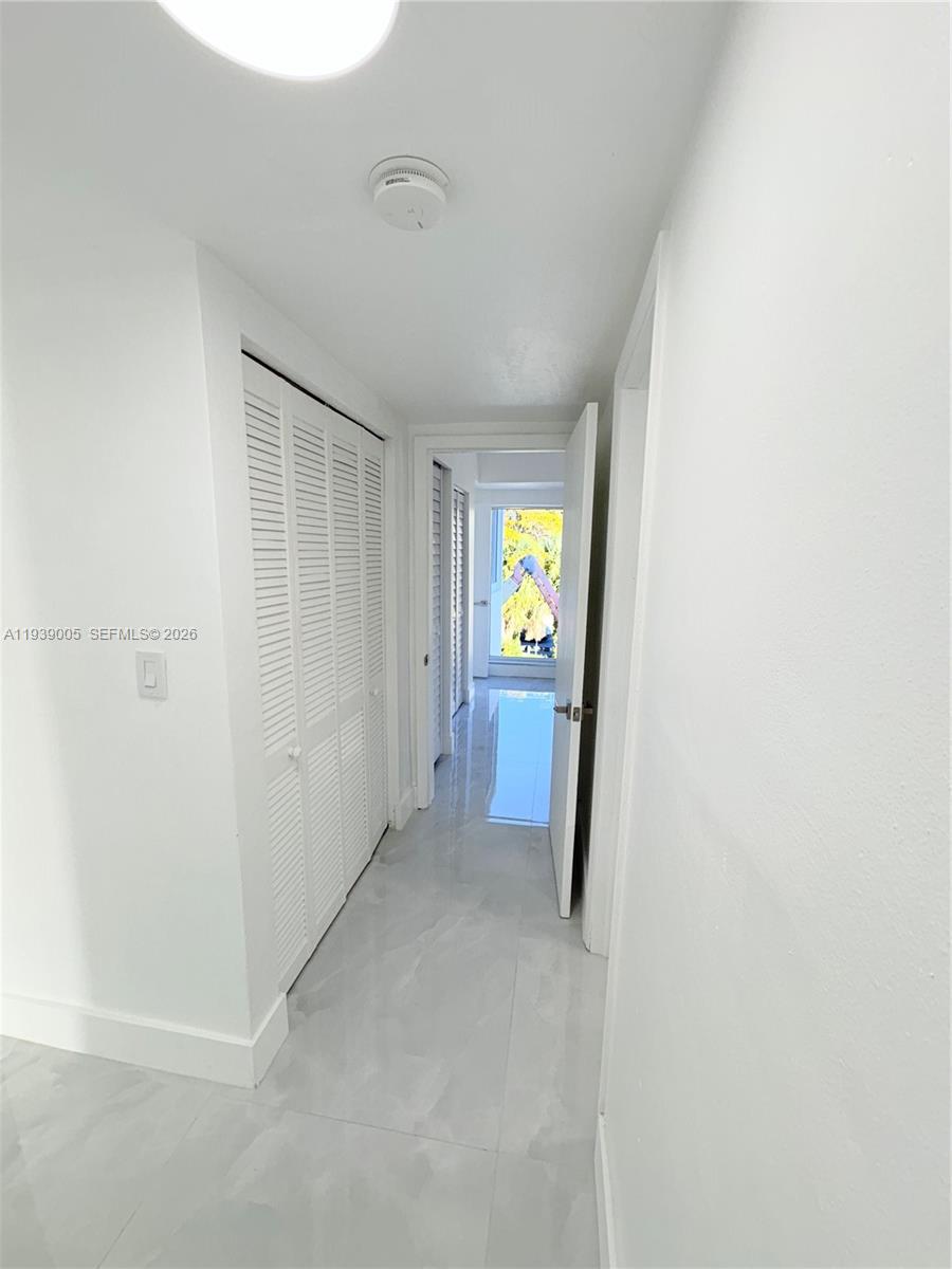 9159 Southwest 77th Avenue, Unit 314 Miami, FL 33156 - Photo 38 of 53 a view of an empty room and a window