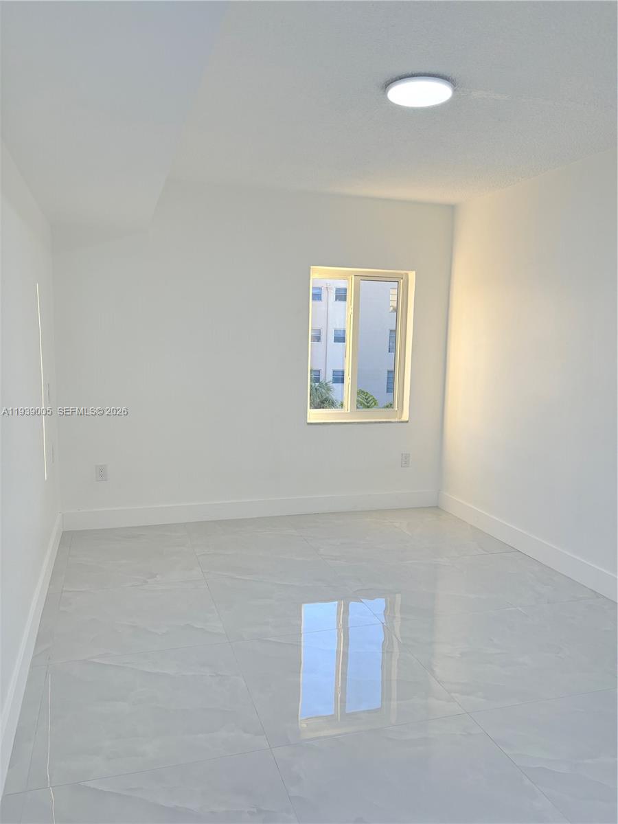 9159 Southwest 77th Avenue, Unit 314 Miami, FL 33156 - Photo 39 of 53 a view of an empty room