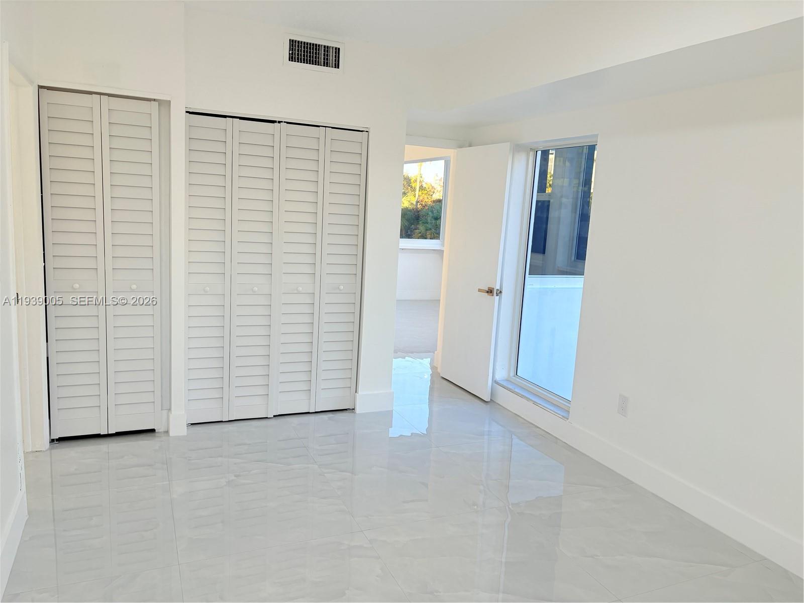 9159 Southwest 77th Avenue, Unit 314 Miami, FL 33156 - Photo 40 of 53 an empty room with closet
