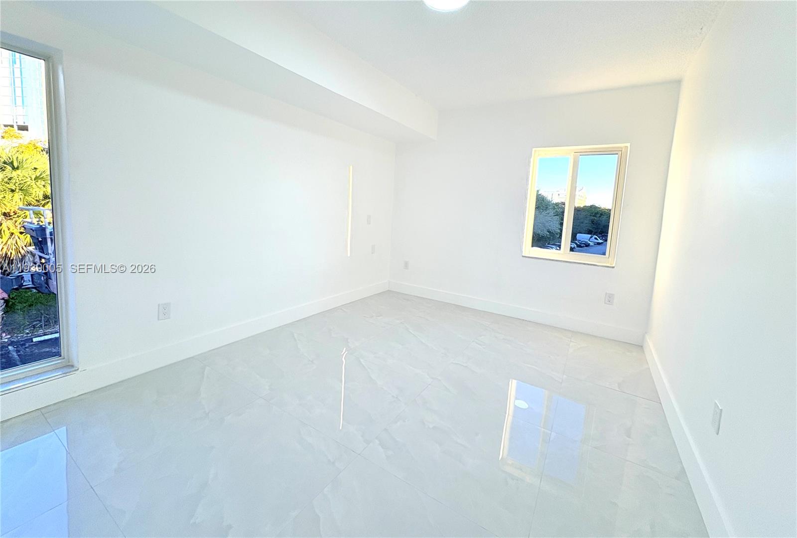 9159 Southwest 77th Avenue, Unit 314 Miami, FL 33156 - Photo 41 of 53 an empty room with a window