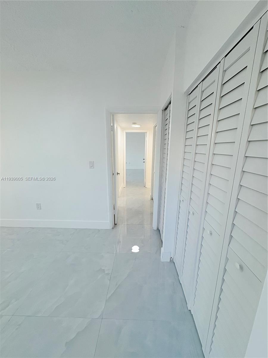 9159 Southwest 77th Avenue, Unit 314 Miami, FL 33156 - Photo 42 of 53 a view of a room with an empty space