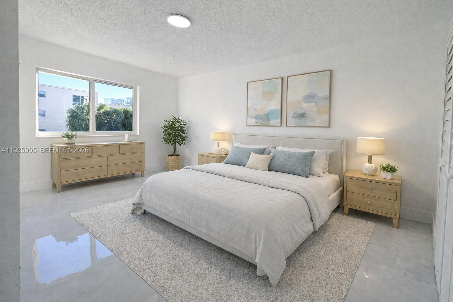 9159 Southwest 77th Avenue, Unit 314 Miami, FL 33156 - Photo 6 of 53 a bedroom with a large bed and a window