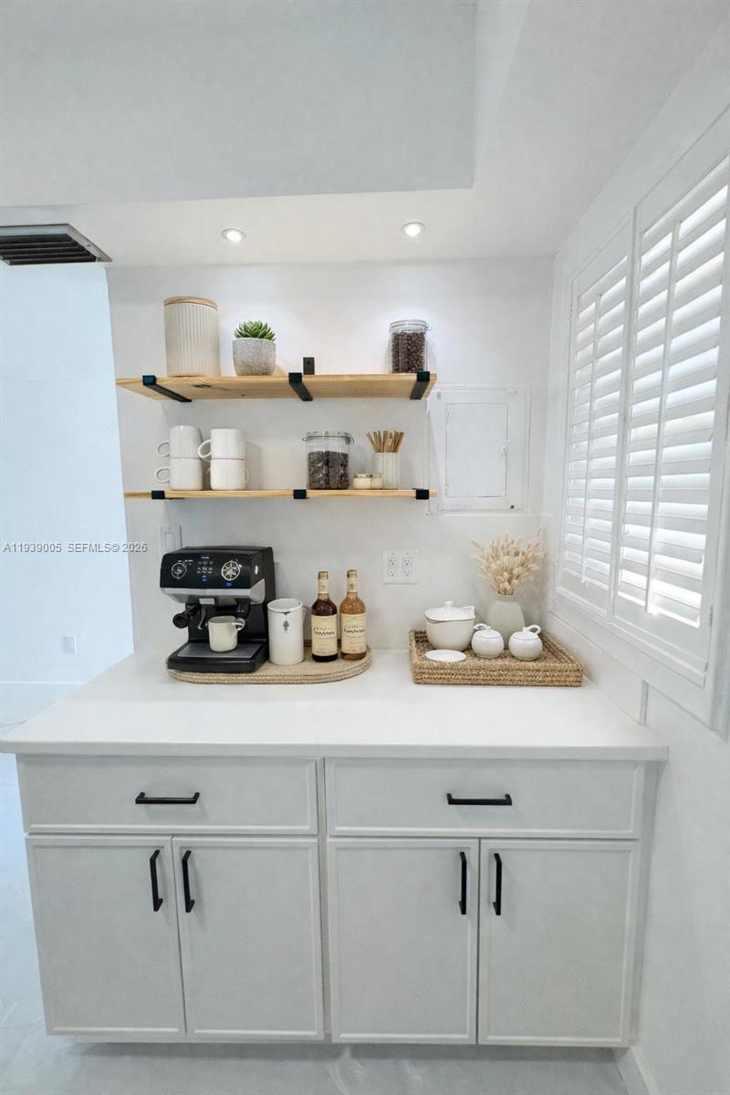 9159 Southwest 77th Avenue, Unit 314 Miami, FL 33156 - Photo 9 of 53 a kitchen with cabinets
